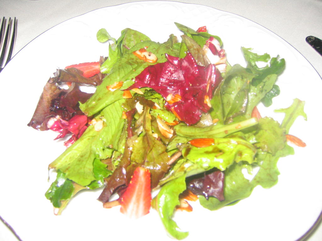 the salad with strawberries in a balsamic reduction
