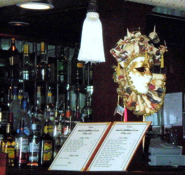 The bar at Perugia. Mardi-Gras mask