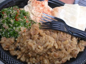 A plate from Barady's Bistro. This restaurant is located on Genesee St. in Utica. The plate offered pita bread, tabouli, hummus and lentils with rice. 