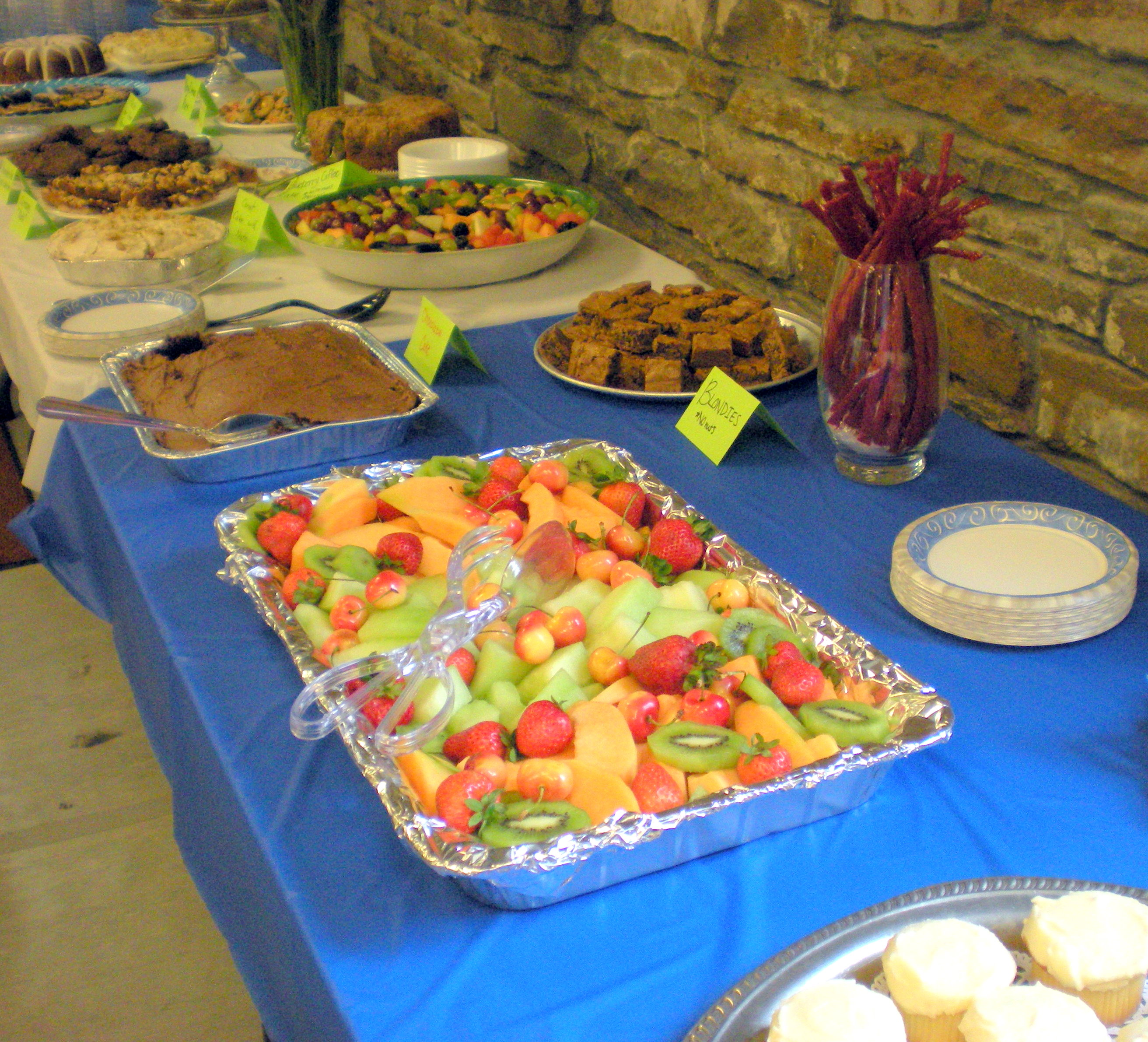The ENDLESS dessert table: Cupcakes, fruit, brownies, carrot cake, cookies...