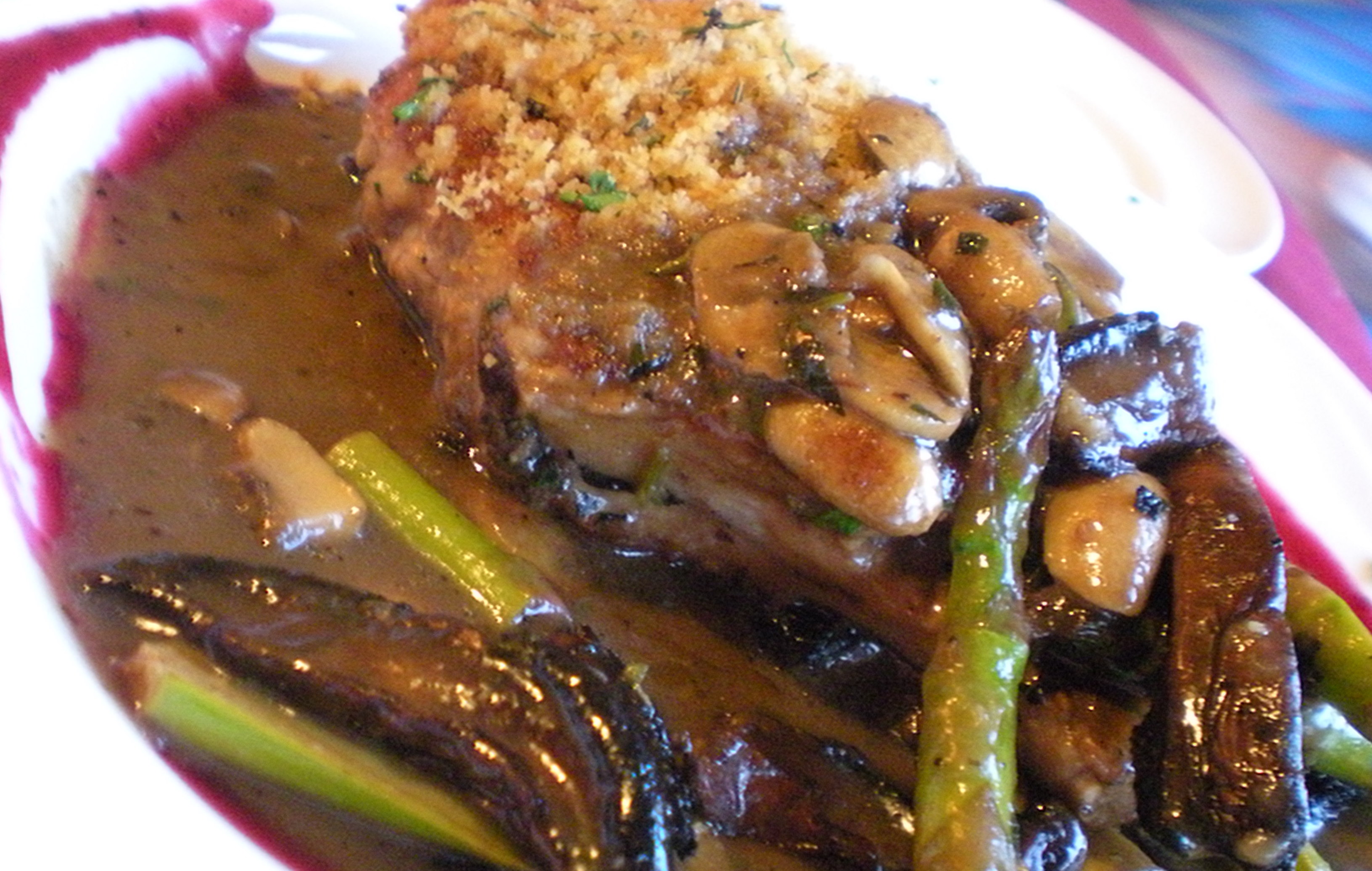 My father had this succulant looking pork chop in gravy with mushrooms